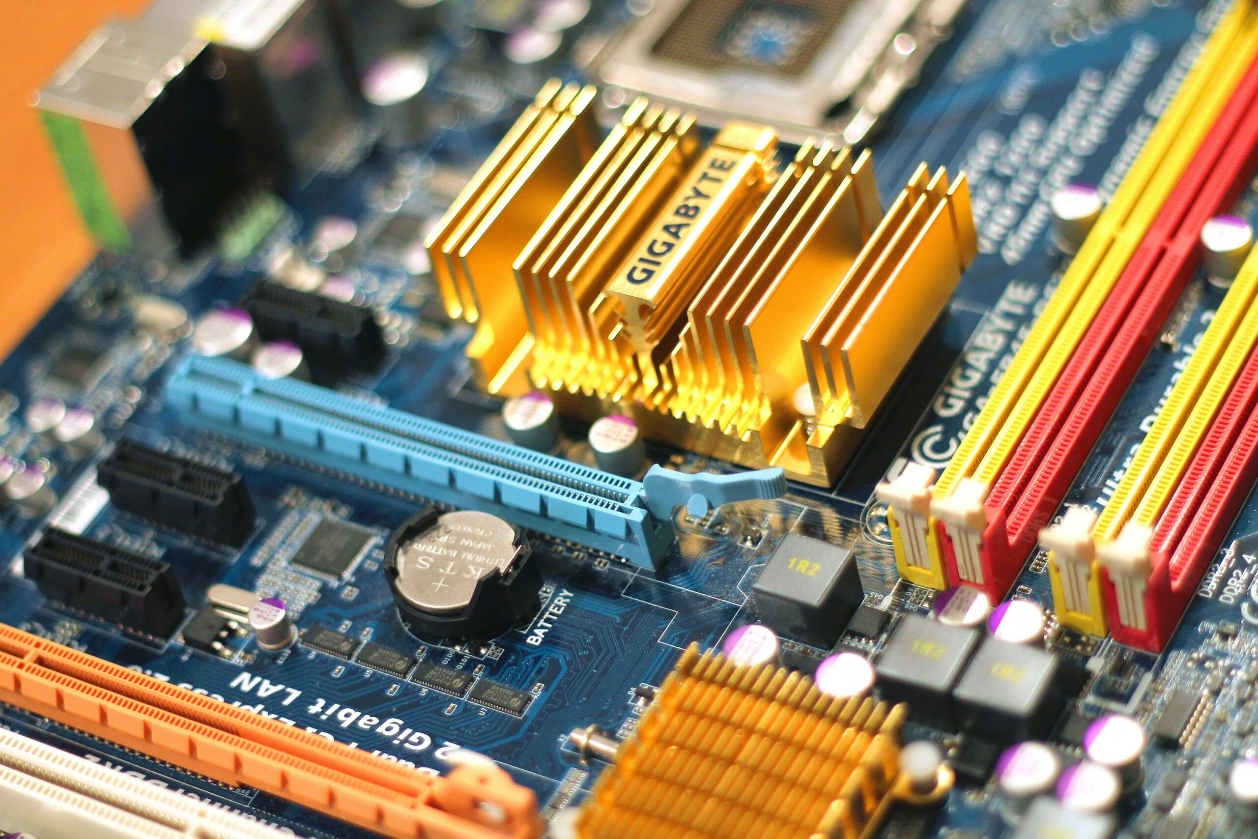 Detailed close-up of a computer motherboard showcasing various electronic components.